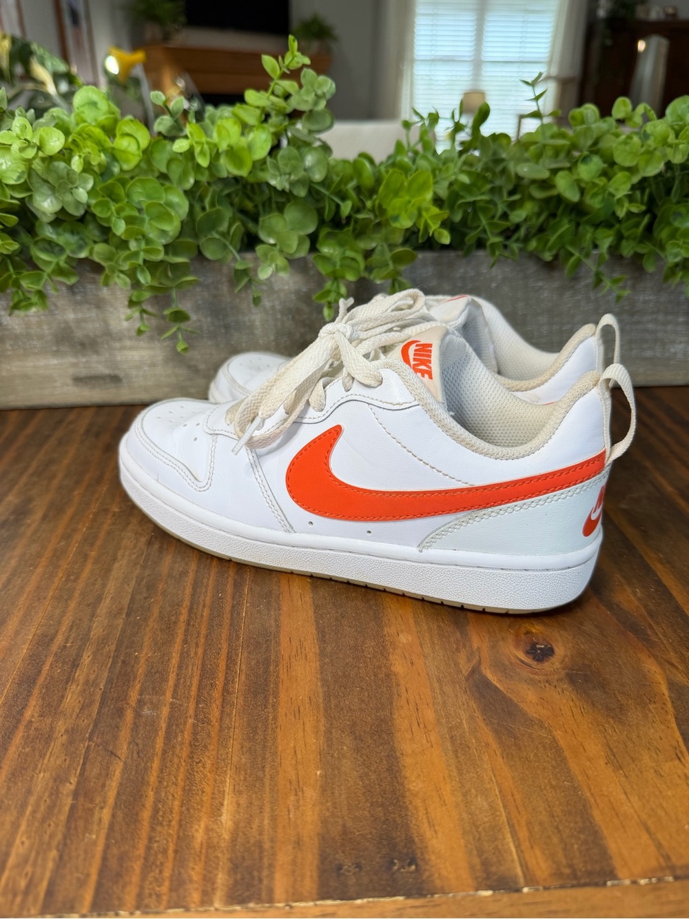 Nike Kids White Sneakers with Bright Orange Swoosh